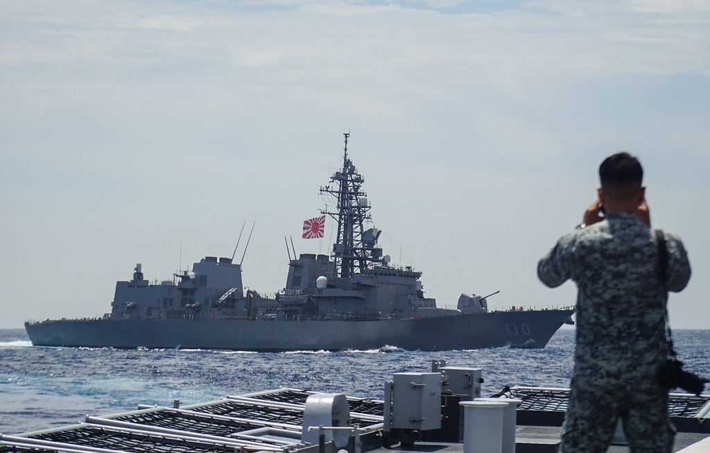 A member of the Philippine Navy looks out at the Japan Maritime Self-Defence Force’s destroyer Takanami during a joint maritime exercise in the South China Sea on June 14. Photo: Jiji Press / AFP