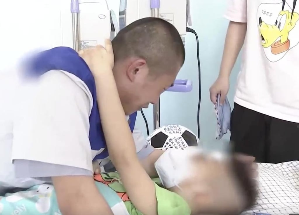 Then prisoner, Yu Haibo, visits his dying son in hospital. At the end of the visit, his frail boy told him to “be good” in jail. Photo: Handout