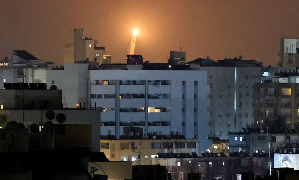 Rocket trails are seen in the sky above the Israeli coastal city of Netanya amid a fresh barrage of Iranian missile attacks on Tuesday. Photo: AFP
