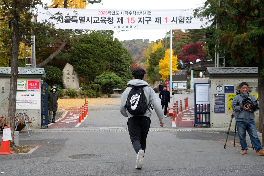 A student runs to take a university entrance exam in Seoul last year. The death of three teenage girls has sparked calls for education reforms in South Korea. Photo: AP