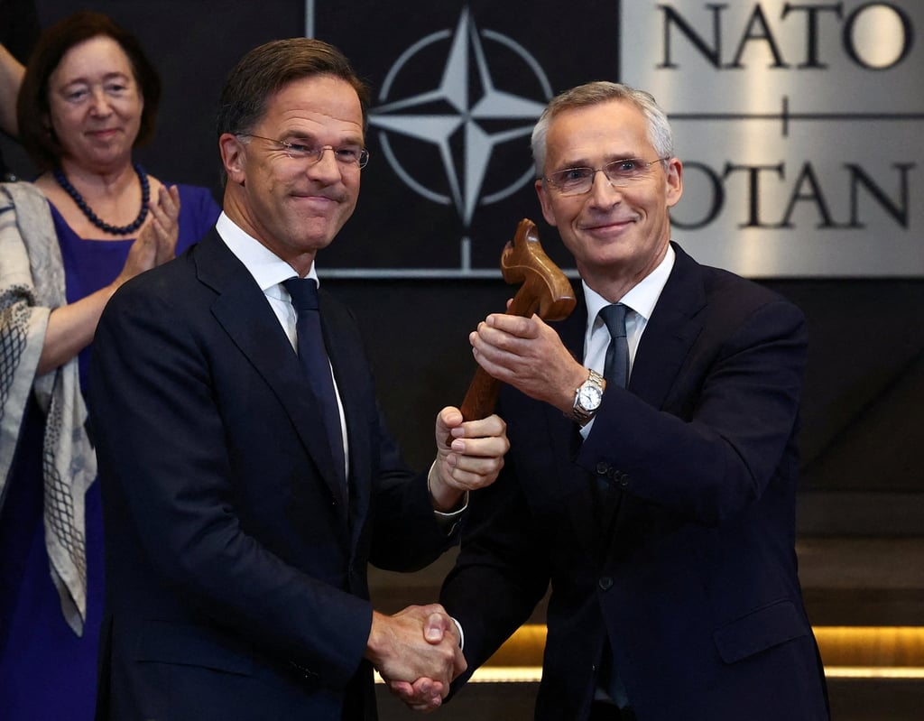 Jens Stoltenberg (right) shakes hands with the new Nato Secretary General Mark Rutte at the alliance’s headquarters in Brussels on October 1, last year. Photo: ReutersY