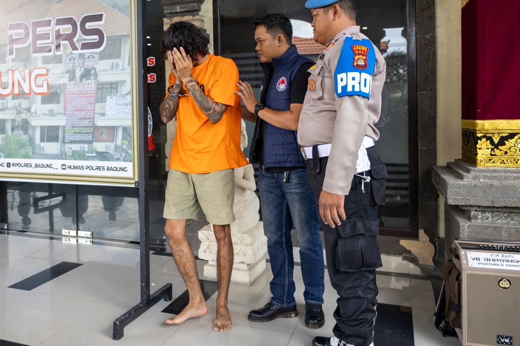 Australian national Nelson James is escorted by police during a press conference at a station in Badung, Bali, on June 14. He was arrested for alleged drug possession. Photo: EPA-EFE