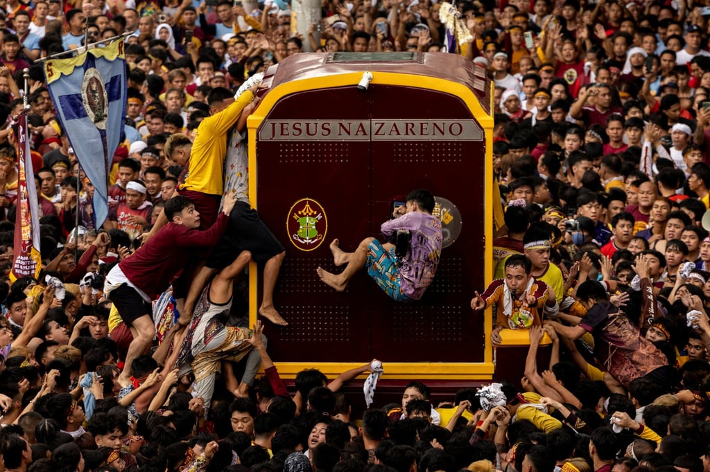 Filipino Catholic devotees jostle to touch the carriage carrying the statue of the Black Nazarene during the annual procession on its feast day in Manila on January 9. Nearly 79 per cent of Filipinos are Roman Catholic. Photo: Reuters
