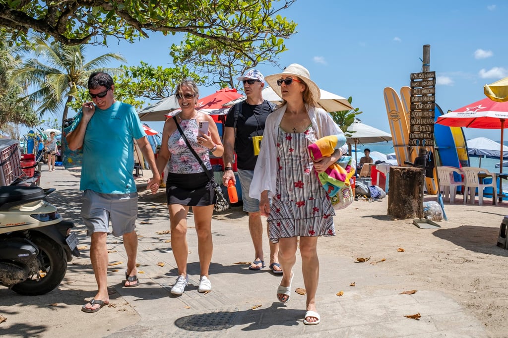 Tourists at Kuta Beach in Bali. More residents are complaining about overtourism on the island. Photo: EPA-EFE