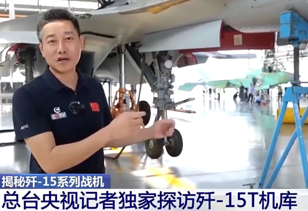 During a CCTV report on Tuesday, at least two J-35 fighter jets were spotted in a hangar of its developer, Shenyang Aircraft Corporation. The stealth aircraft, painted green, can be seen in the background. Photo: CCTV