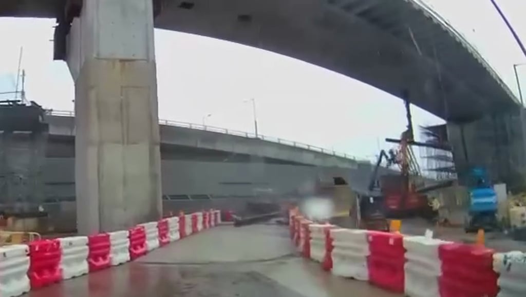 A dashcam video captures the collapsed iron beam landing on a road within the site. Photo: Handout