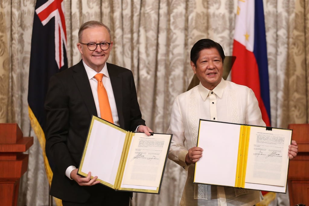 Australian Prime Minister Anthony Albanese and Philippine President Ferdinand Marcos Jnr display signed documents after upgrading bilateral relations in September 2023. Photo: EPA-EFE