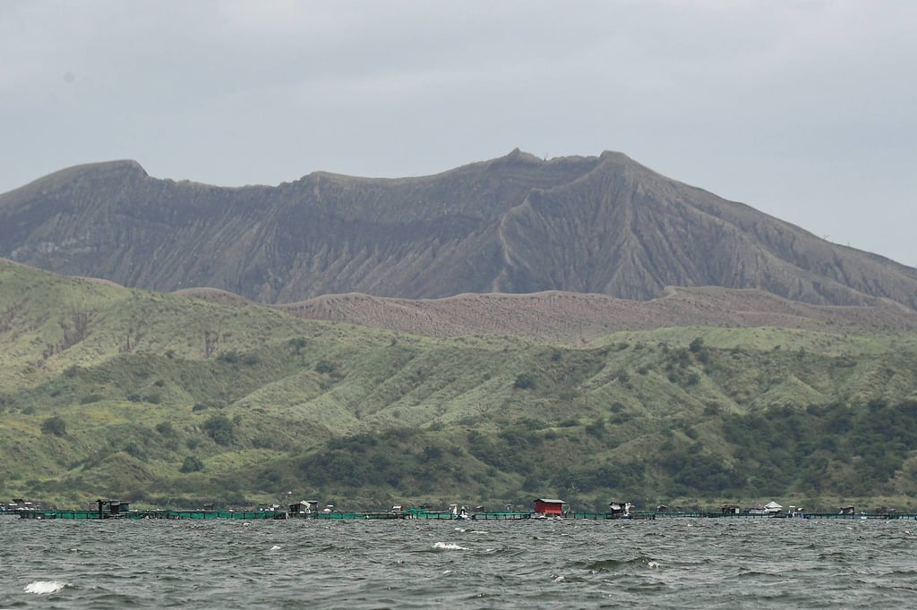The Taal volcano crater with fish cages (bottom), seen along Taal Lake off Laurel town, Batangas province, south of Manila, on Thursday. Taal is a popular tourist spot in the Philippines. Photo: AFP