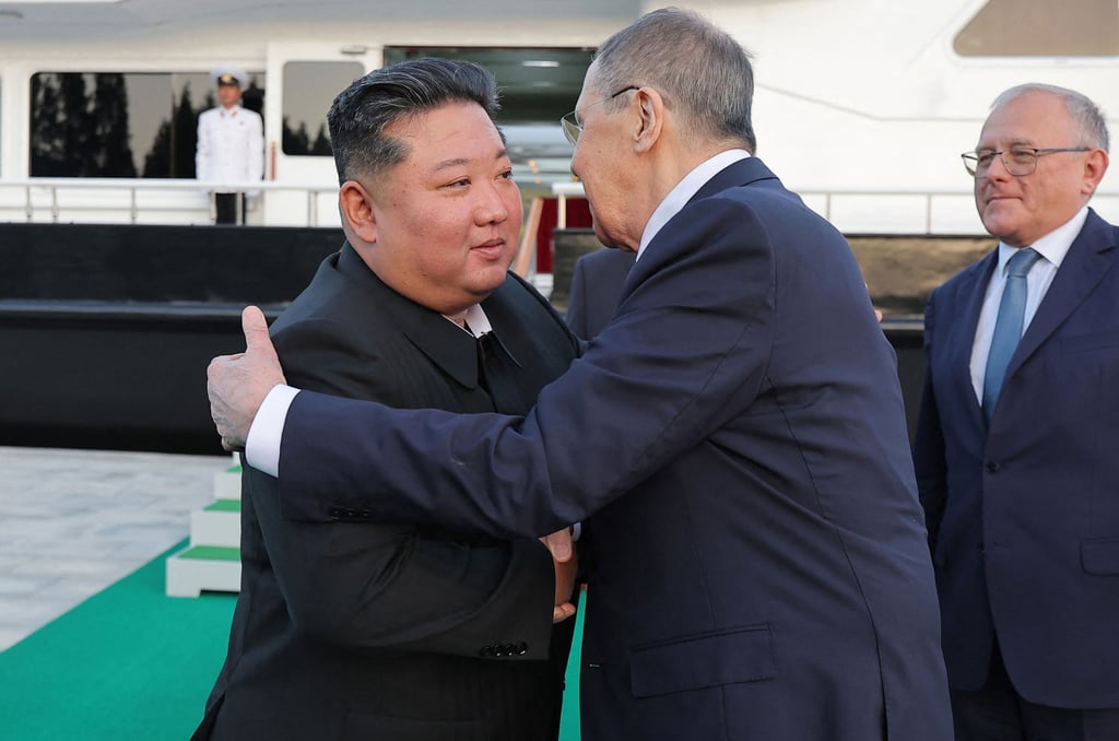 Russian Foreign Minister Sergey Lavrov embraces North Korean leader Kim Jong-un on Saturday. Photo: KCNA/KNS/AFP