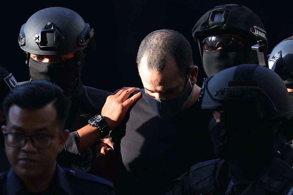 Israeli Shalom Avitan (centre) being escorted by Royal Malaysia Police officers to Kuala Lumpur Sessions Court on April 12, 2024. Avitan was sentenced to seven years’ jail in February. Photo: EPA-EFE