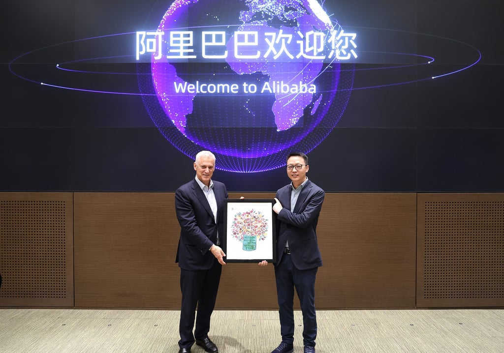 Standard Chartered CEO Bill Winters and Eddie Wu Yongming, CEO of Alibaba Group Holding, mark the two companies’ AI deal at the Chinese firm’s headquarters in Hangzhou. Photo: Handout
