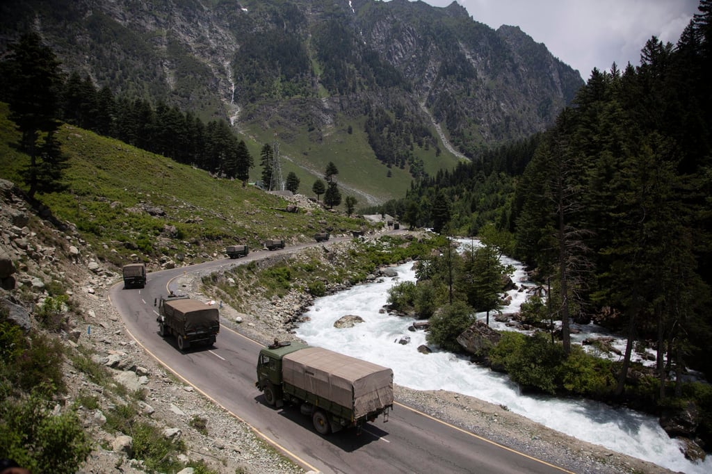 An Indian army convoy moves on the Srinagar-Ladakh highway at Gagangeer, north-east of Srinagar. June 17, 2020. Photo: AP