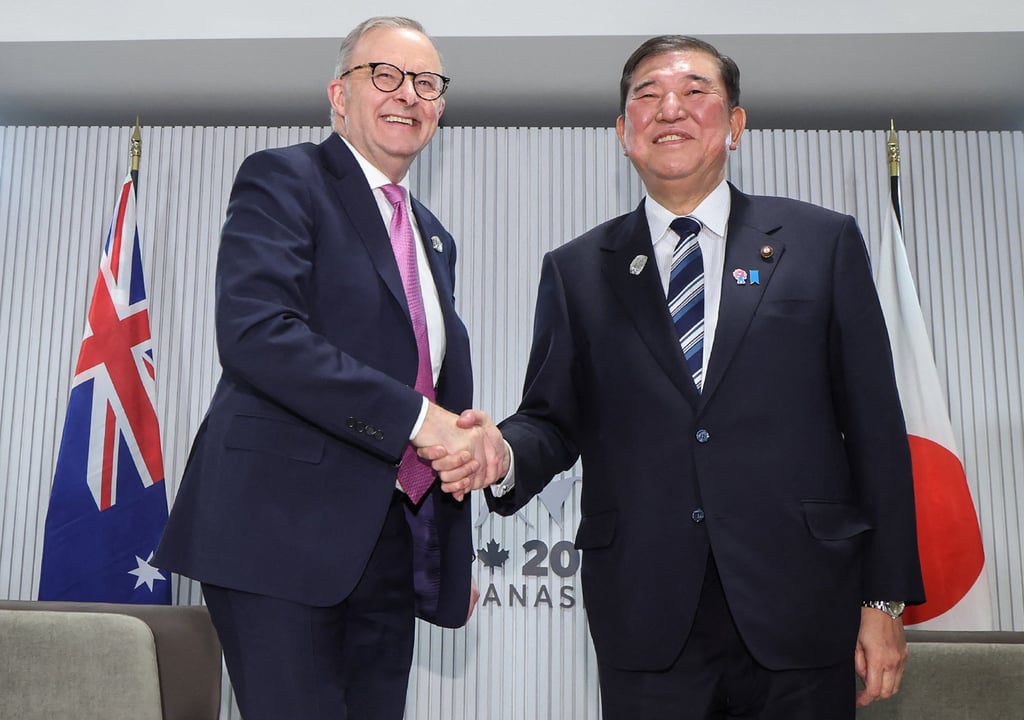 Australia’s Prime Minister Anthony Albanese (left) shakes hands with his Japanese counterpart Shigeru Ishiba during a meeting on the sidelines of the G7 Summit in June. Photo: Jiji Press / AFP