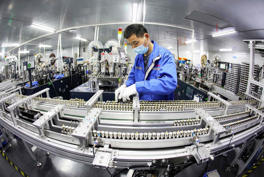 An employee works on a lithium battery production line at a factory in Huaibei, Anhui province, China, in April. Photo: AFP