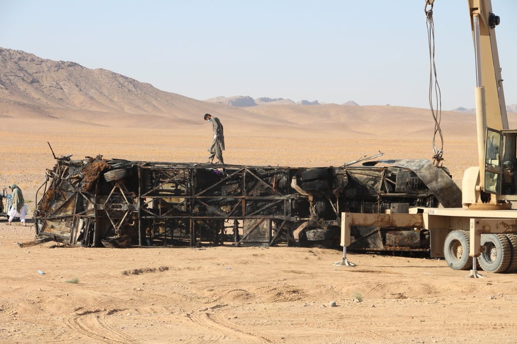 Rescue officials work at the scene of a bus accident in Herat, Afghanistan on Wednesday. Photo: EPA