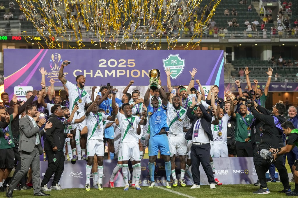 The Saudi Super Cup trophy is lifted by winners Al-Ahli. Photo: Elson Li