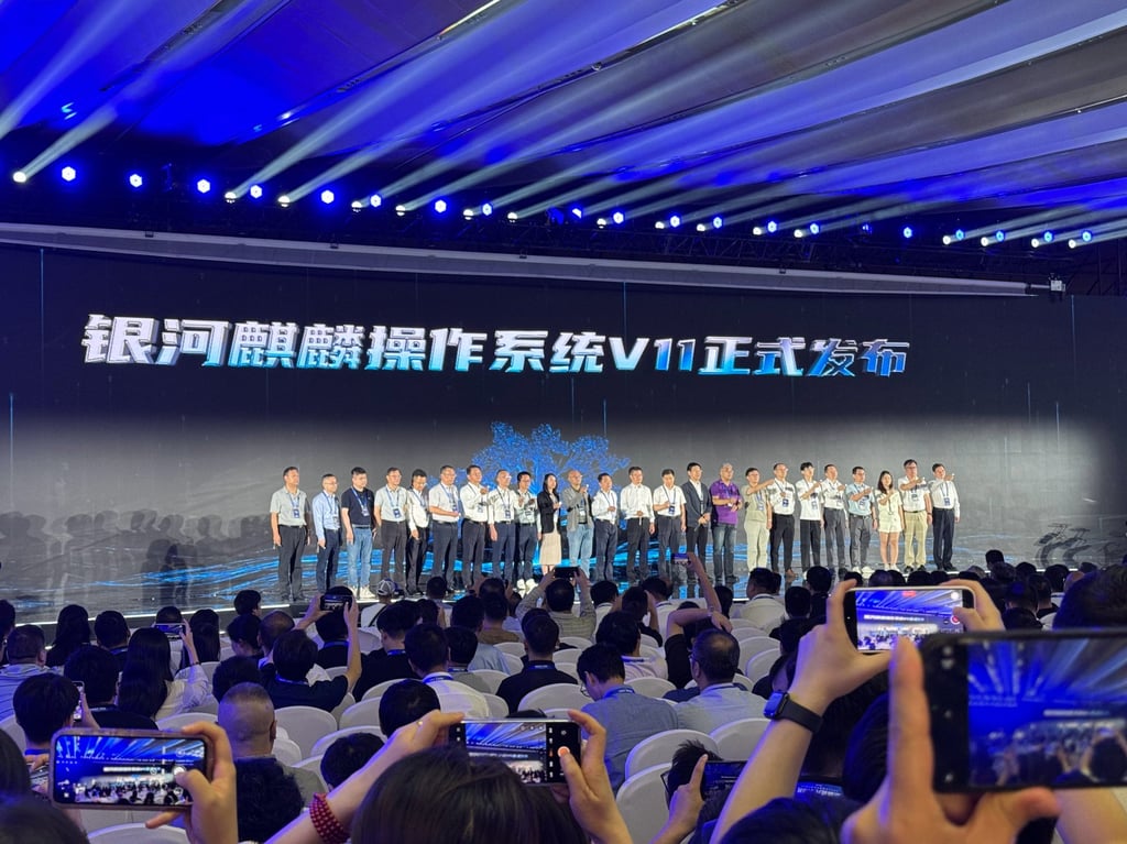 Executives of Kylin Software appear on stage at the company’s launch of its latest operating system upgrade at the China Operating System Industry Conference on Tuesday in Beijing. Photo: Handout