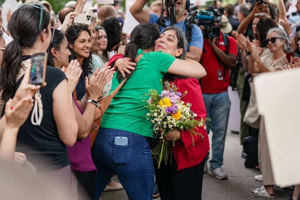 Former CDC official Deb Houry gets a hug as CDC staff and supporters line up outside the agency’s global headquarters on Wednesday to honour her and two other leaders who resigned in the wake of Susan Monarez being fired. Photo: AFP
