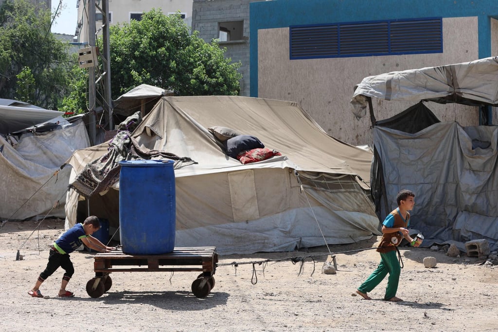 Palestinian boys transport a plastic container in the Sheikh Radwan neighbourhood of Gaza City last month. Photo: AFP