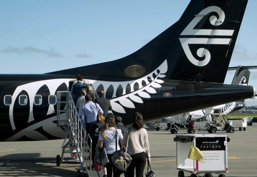 Passengers board an Air New Zealand flight at Christchurch Airport. Photo: AP