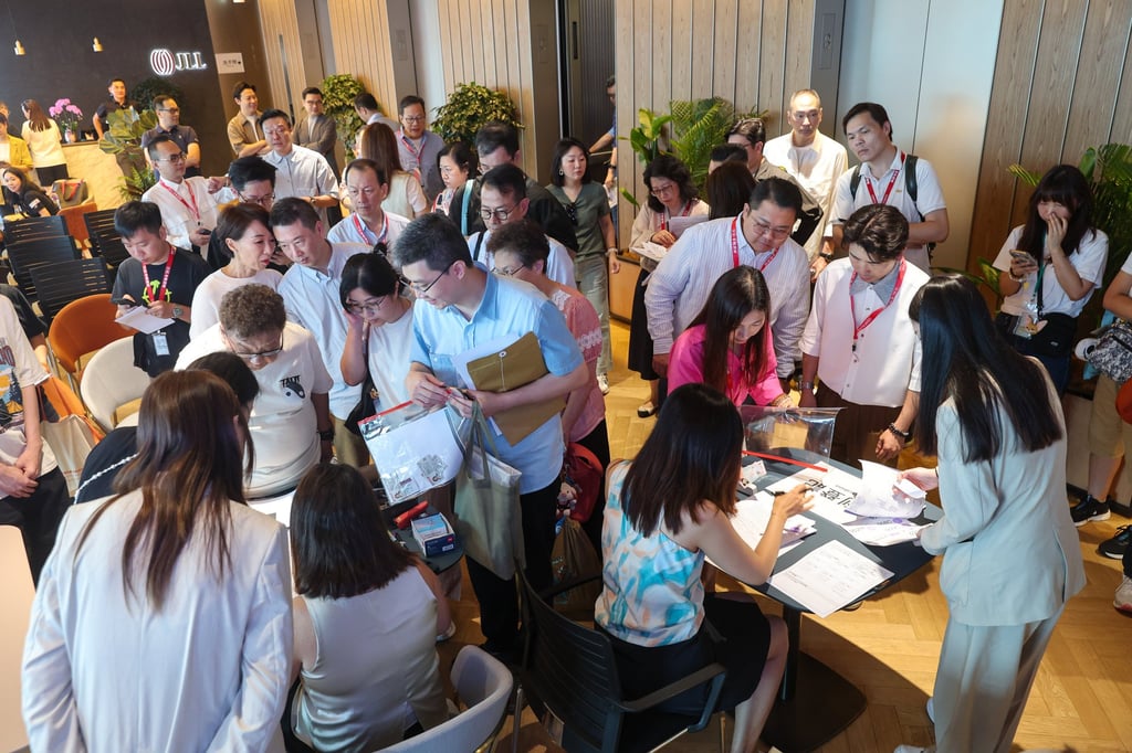 Potential buyers and estate agents at the sales office of 33 Kennedy Road, the 71-unit completed project in Wan Chai jointly developed by The Development Studio and Fu Hop Investment, on August 10. Photo: Edmond So