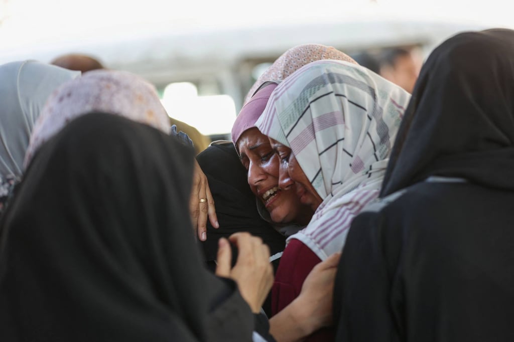 Palestinian women mourn the death of loved ones outside a hospital in Gaza City on Tuesday. Photo: AFP