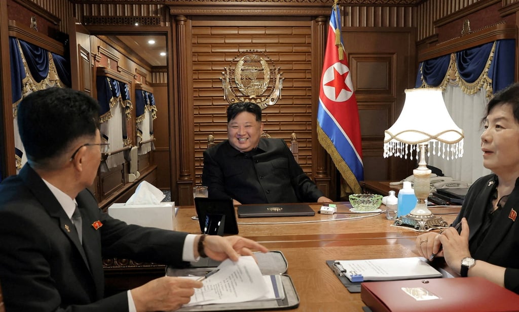 North Korean leader Kim Jong-un inside his special train as he leaves Pyongyang for China in a photo released on Tuesday. Photo: KCNA/Reuters