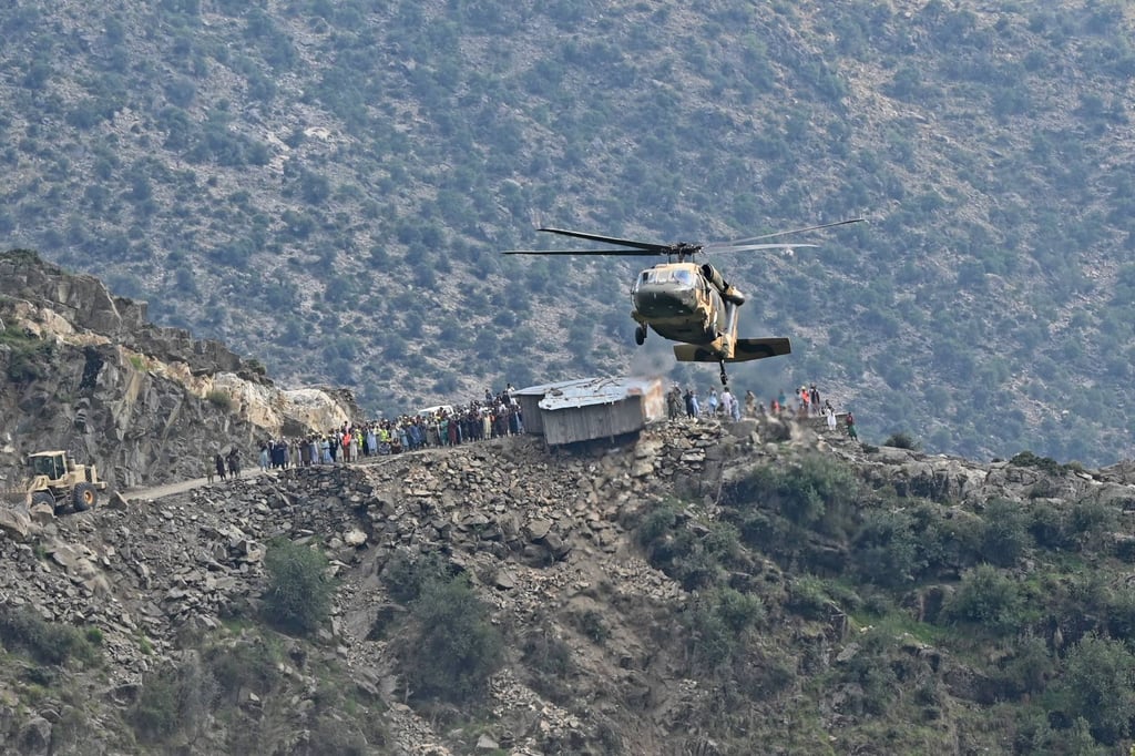 A military helicopter airlifts injured Afghans from a village in Kunar province on Monday. Photo: AFP