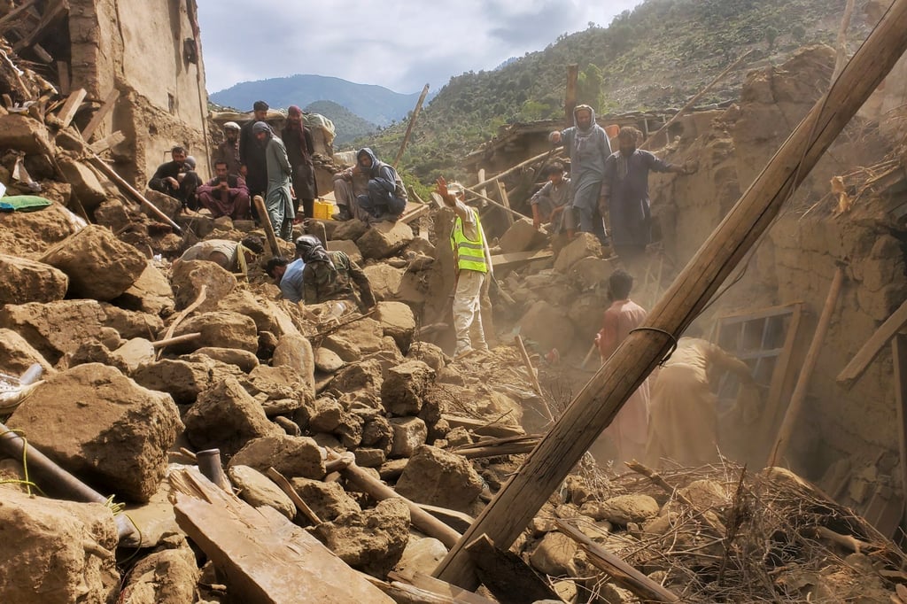 People clear rubble as they search for survivors in Mazar Dara, Kunar province. Photo: AFP