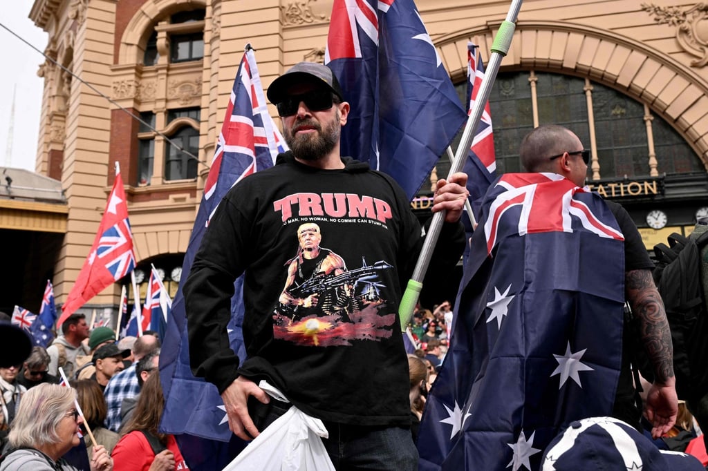 A protester wearing a shirt showing an image of US President Donald Trump as a stylised depiction of Rambo during the “March for Australia” anti-immigration rally in Melbourne on August 31. Photo: AFP