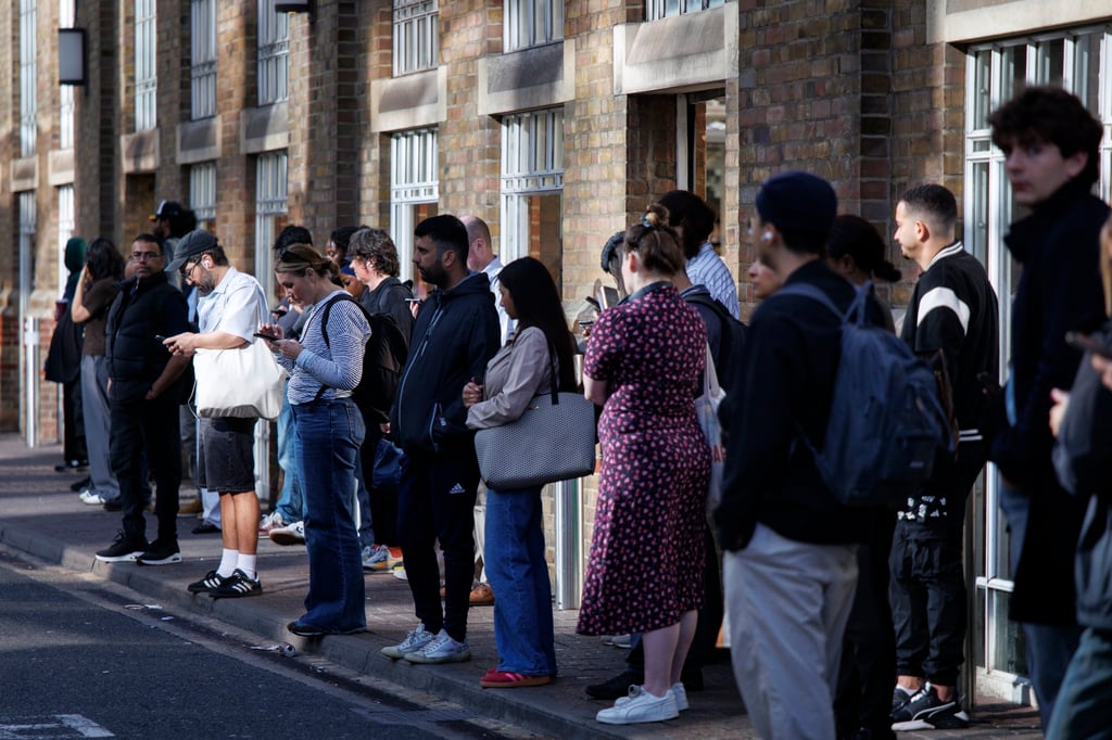 Commuters queue for bus services due to a Tube strike that has shut down nearly all London Underground services in London, Britain, on Monday. Photo: EPA