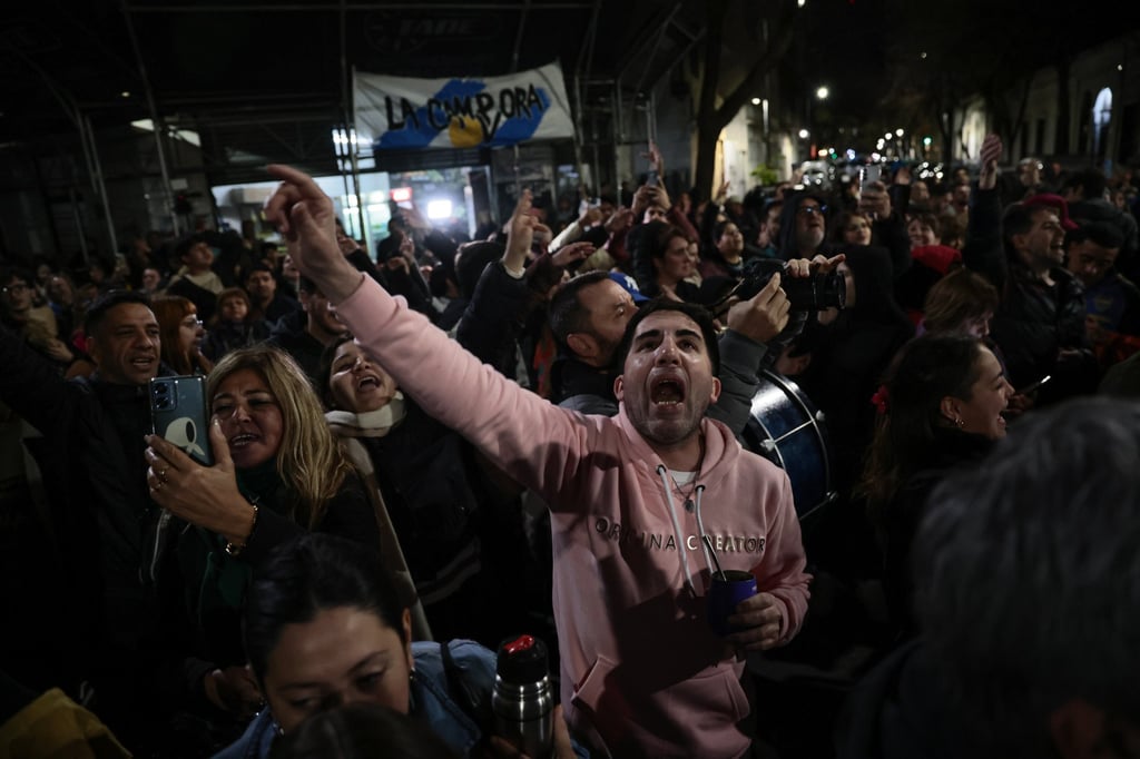 People celebrate the results of the legislative elections in the province of Buenos Aires in front of the home of former president Cristina Fernández de Kirchner. Photo: EPA