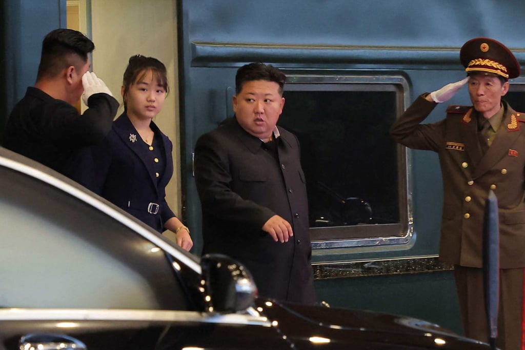 North Korean leader Kim Jong-un and his daughter Ju-ae (second from left) arrive back in Pyongyang on Friday after returning from China. Photo: KCNA/KNS /AFP
