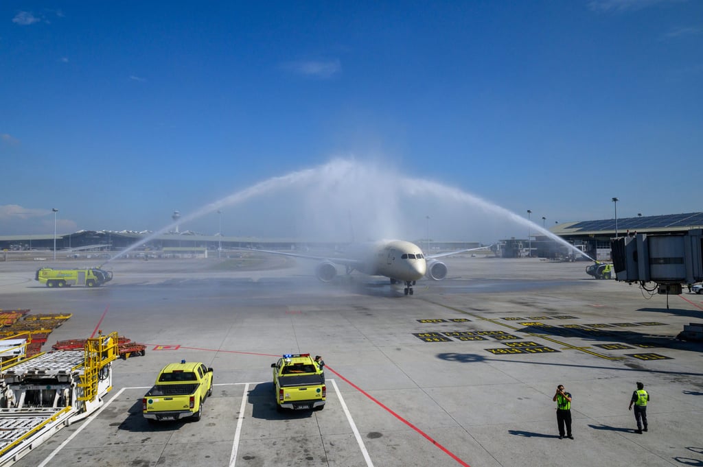 A passenger plane is welcomed by water cannon salute at Kuala Lumpur International Airport in Sepang. Malaysia is already the region’s second-largest MRO provider. Photo: Xinhua