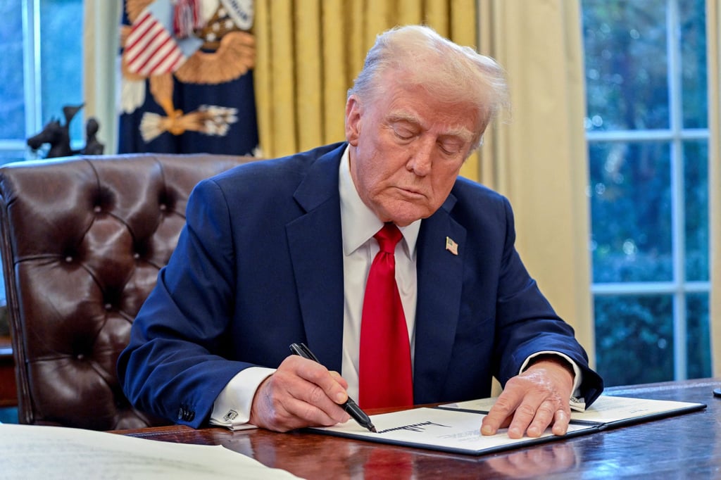 US President Donald Trump signs an executive order in the Oval Office of the White House on January 30. A West Kowloon senior executive at the top of the pay scale takes home over HK$6 million, more than a US president. Photo: TNS