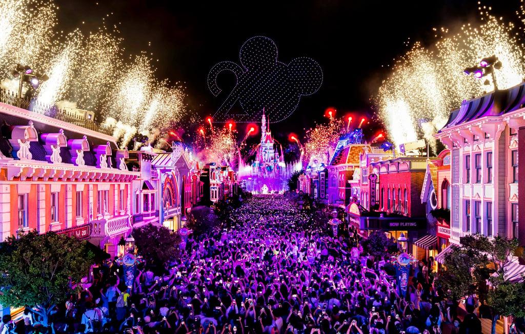 Guests fill Hong Kong Disneyland’s Main Street, USA as they enjoy the resort’s upgraded 20th anniversary nighttime spectacular, Momentous: Party in the Night Sky.