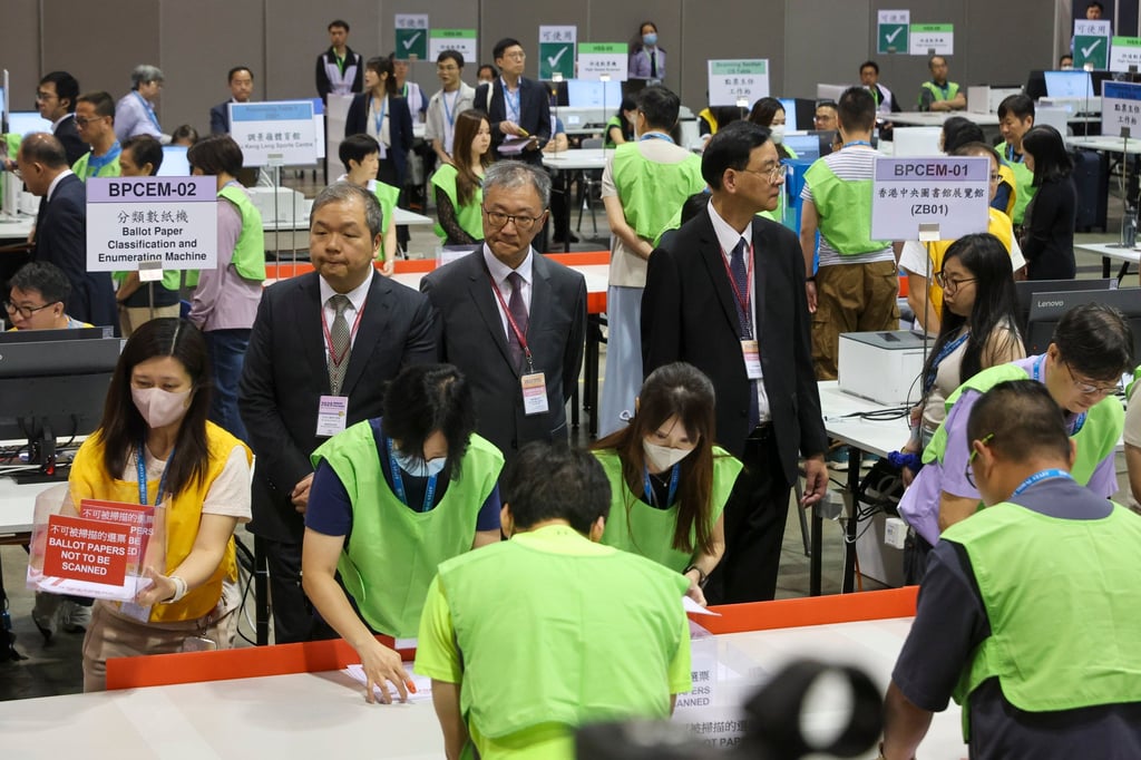 Election officials oversee the Election Committee subsector by-elections at the Hong Kong Convention and Exhibition Centre in Wan Chai on September 7. Photo: Edmond So