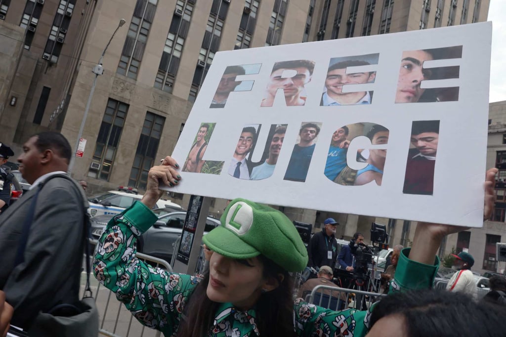 Supporters of Luigi Mangione gather following a hearing outside Manhattan Supreme Court in New York on Tuesday. Photo: AFP