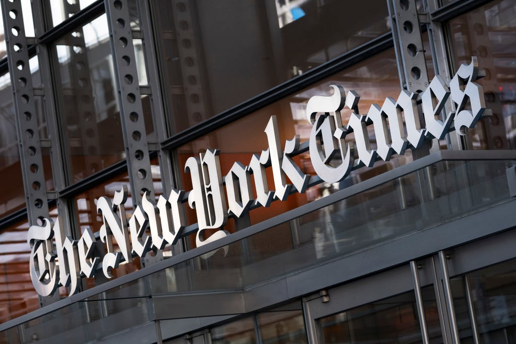 A sign for The New York Times hangs above the entrance to its building in New York in May 2021. Photo: AP