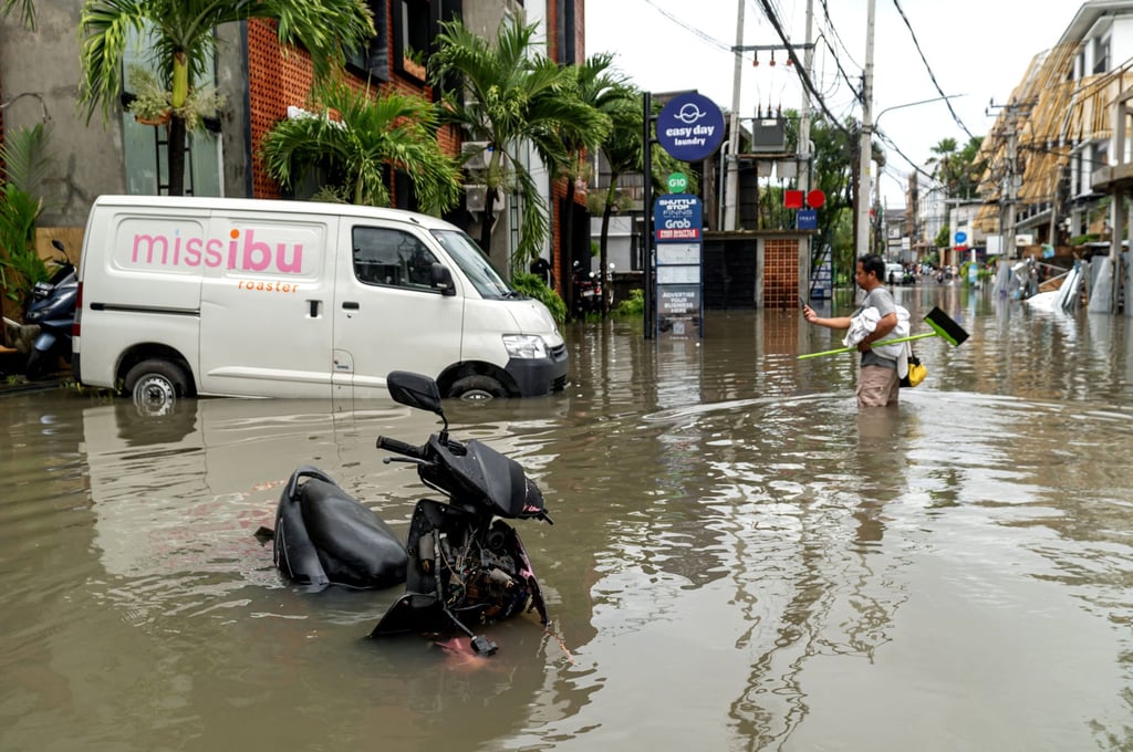 A man stands in floodwater after heavy rain hit Canggu in Badung regency, Bali, Indonesia, on September 15. Photo: Xinhua