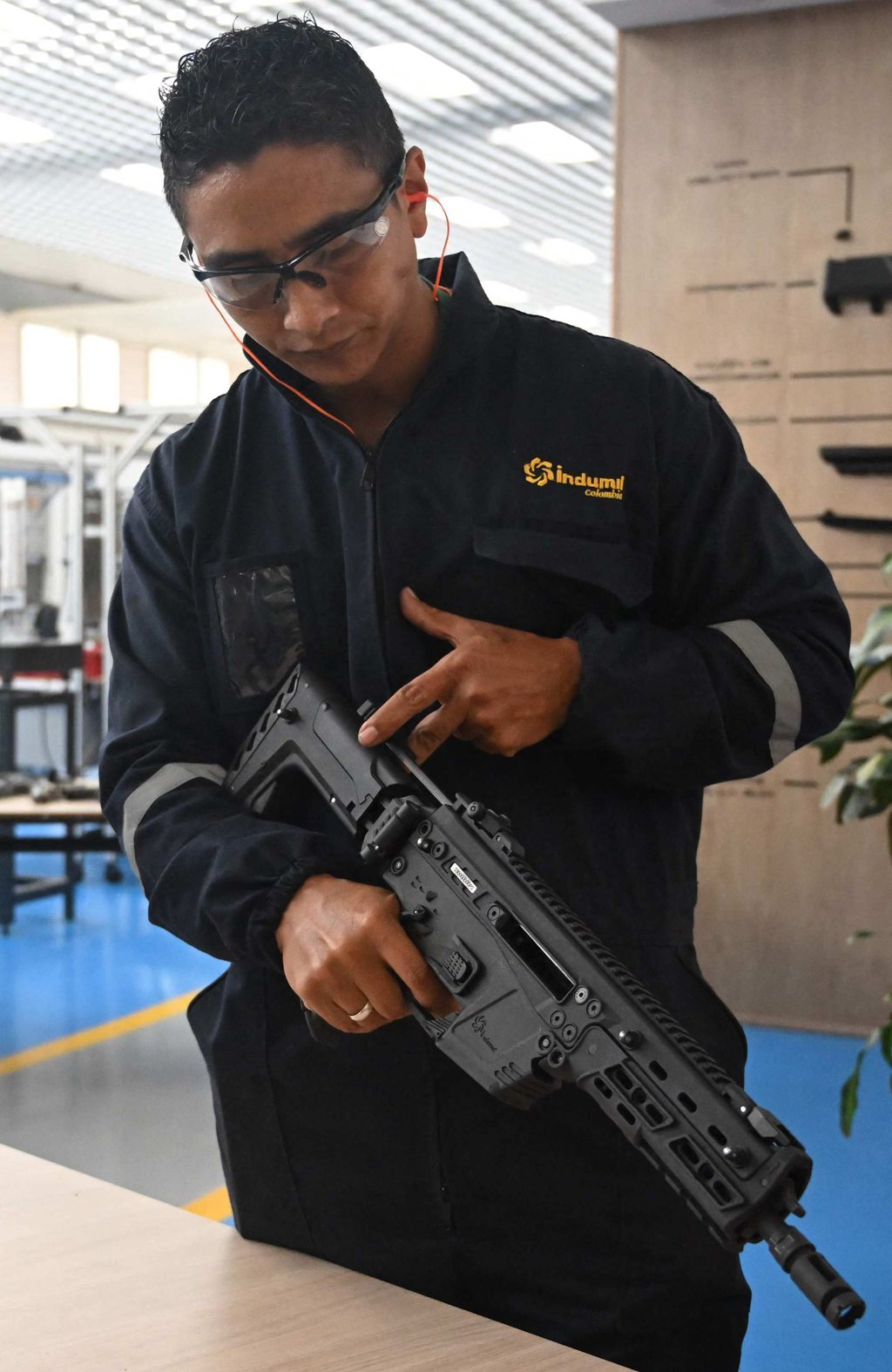 An engineer shows a new rifle created by Colombia’s Indumil at the Jose Maria Cordova Arms and Ammunition Factory near Bogota on Monday. Photo: AFP