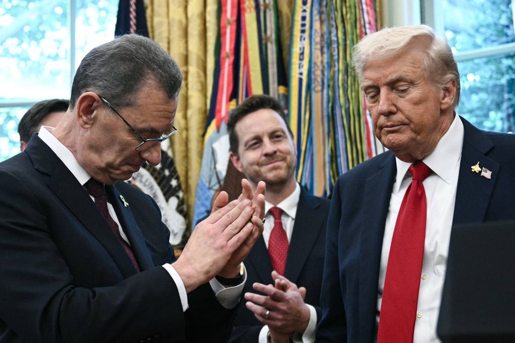 Pfizer CEO Albert Bourla (left) applauds as US President Donald Trump makes an announcement on prescription drugs in the Oval Office on Tuesday. Photo: AFP