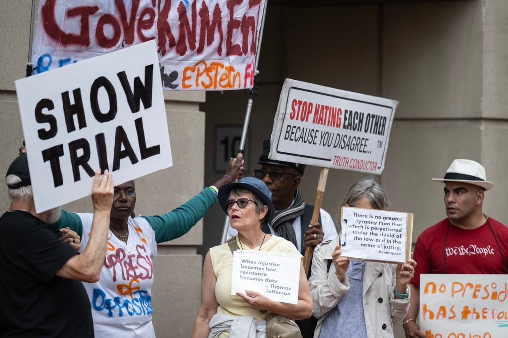 Protesters rally while waiting for former FBI director James Comey to leave his arraignment hearing in Alexandria, Virginia, on Wednesday. Photo: EPA