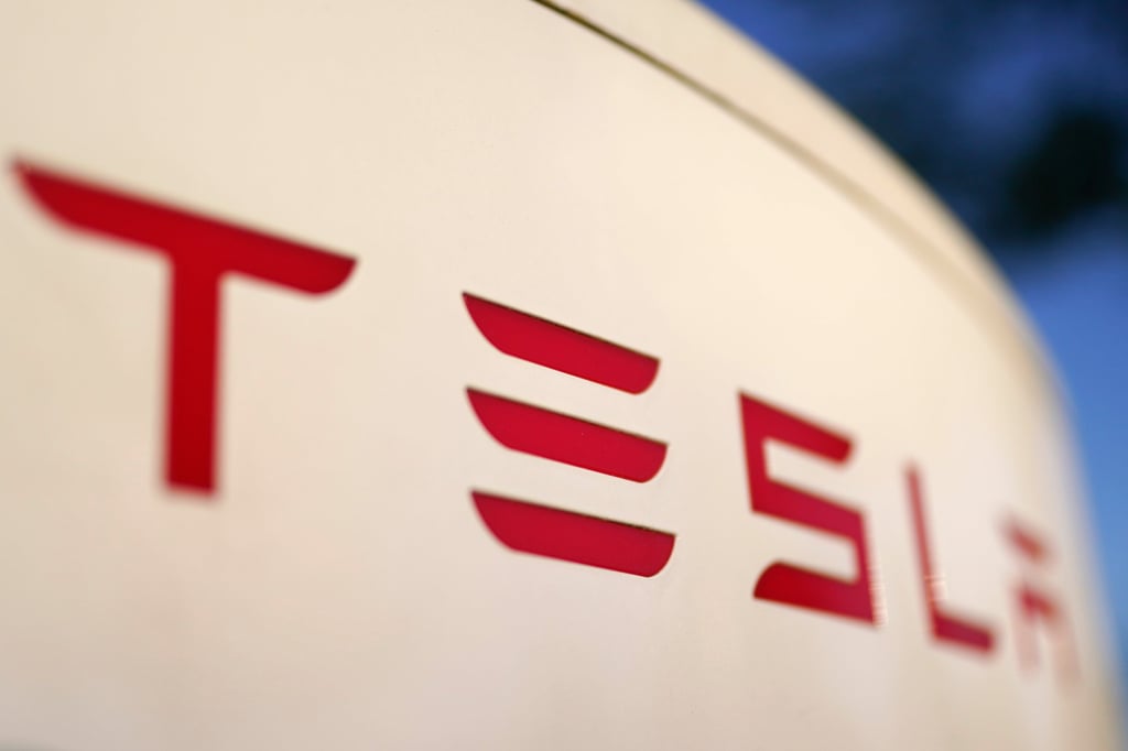 The Tesla logo seen on a supercharger station in Buford, Georgia, US, April 22, 2021. Photo: AP