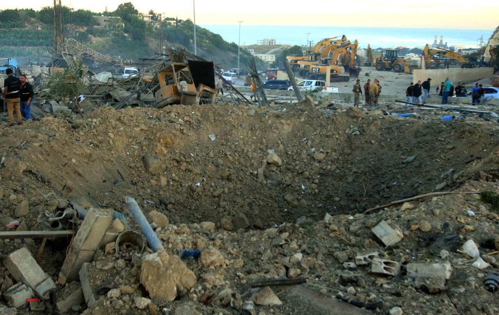Lebanese authorities inspect the damage following an overnight Israeli strike in Msayleh on Saturday. Photo: AFP