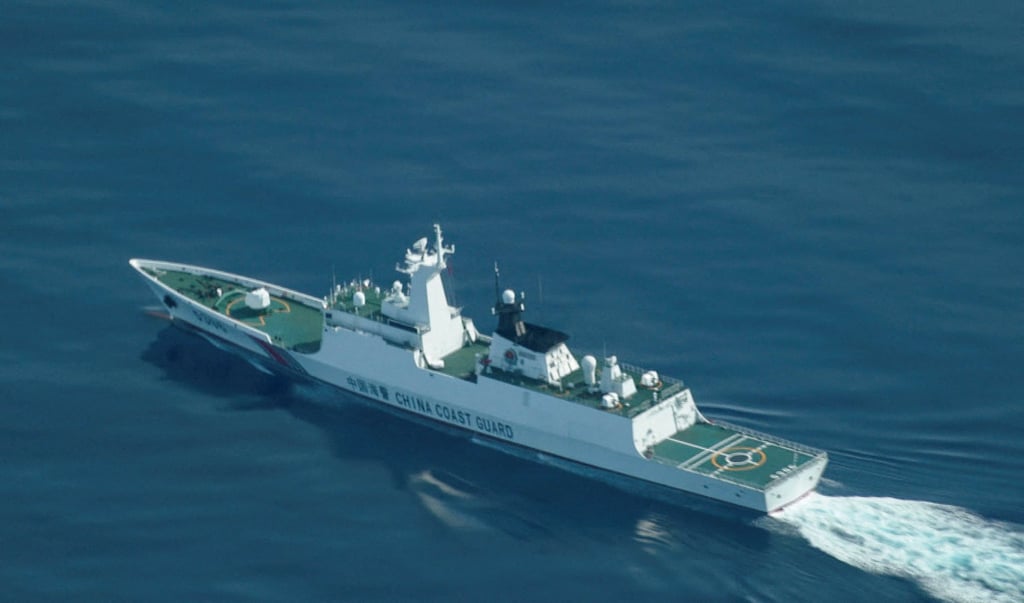 A Chinese coastguard ship sails near the disputed Scarborough Shoal in the South China Sea. Photo: Reuters