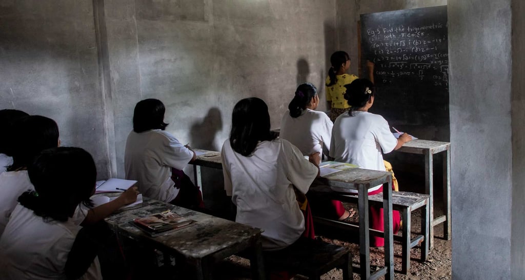 Students take notes in a classroom in a concrete bunker in Sagaing. Photo: AFP