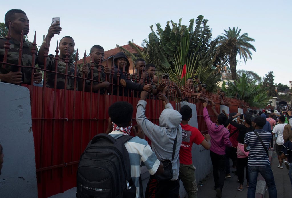 Protesters cheer members of the Madagascar military during a youth-led demonstration in the capital, Antananarivo, on Saturday. Photo: Reuters