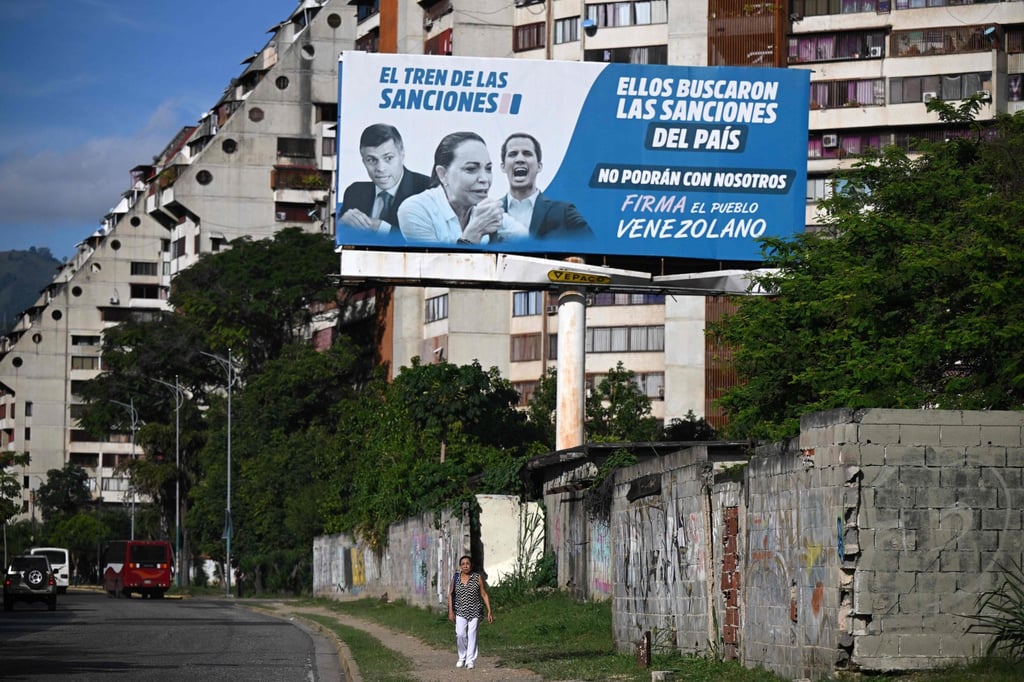 A billboard blaming opposition leaders for supporting US sanctions is displayed in Caracas, Venezuela, on October 10. Photo: AFP