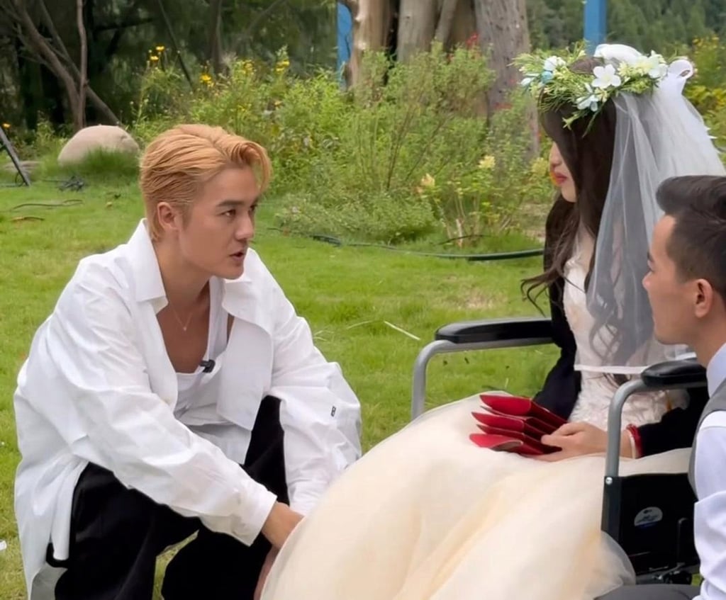 Singer Kenji Wu chats with the couple as they enjoy their belated wedding day. Photo: Handout